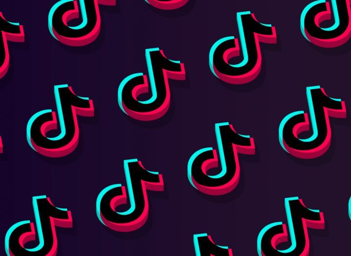 Many TikTok logos on a dark background.