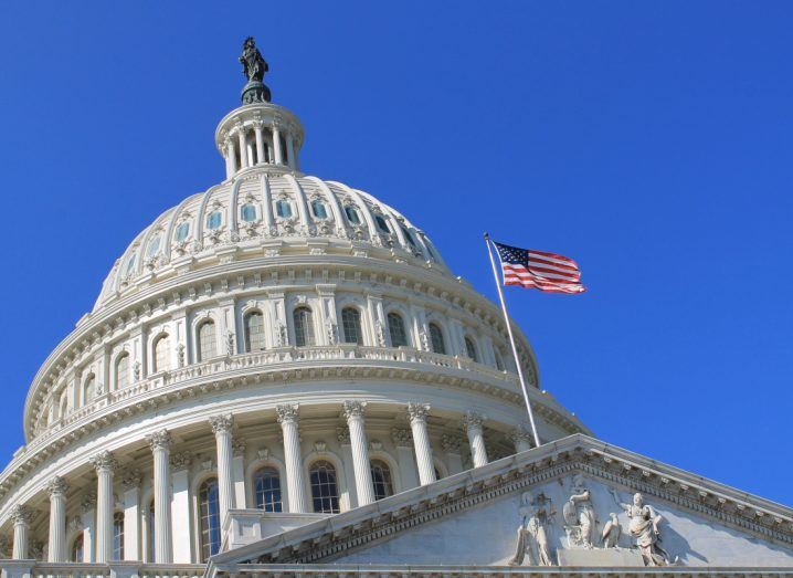 The US capitol building with the US flag visible.