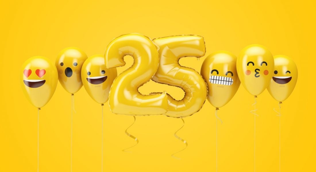 Yellow balloons in the shape of the number 25 flanked by emoji balloons on a yellow background.