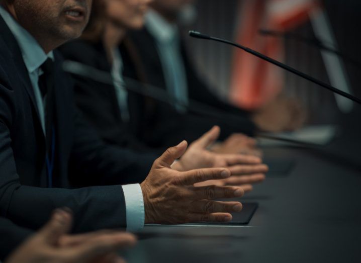 A group of people sitting in front of a desk and microphones. Used to illustrate the US online child safety hearing.