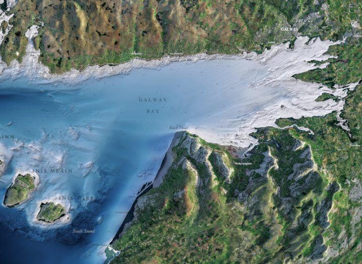 A section of the INFOMAR map of Galway Bay. The bay is blue and there are islands visible and sand as you get to the coast on the right with green land also visible.