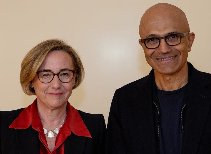 Headshot of a woman and a man standing next to each other.