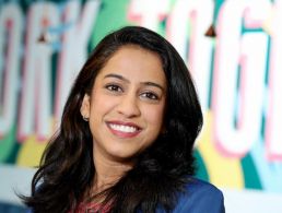 A woman stands smiling at the camera. She is Sonam Chougule, a senior data consultant at BearingPoint Ireland.