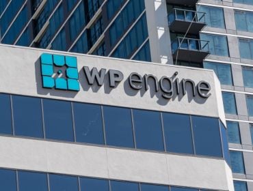 A building with the WP Engine logo on top on a sunny day.